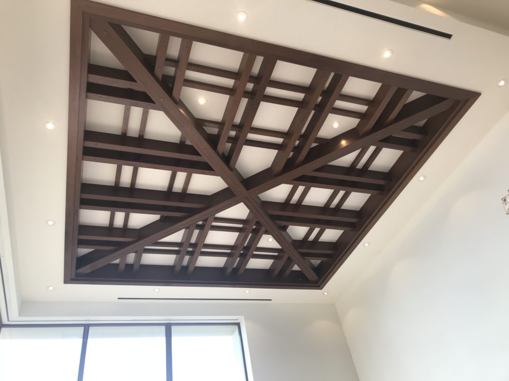 Sapele wood cladding and beam grid architectural installation