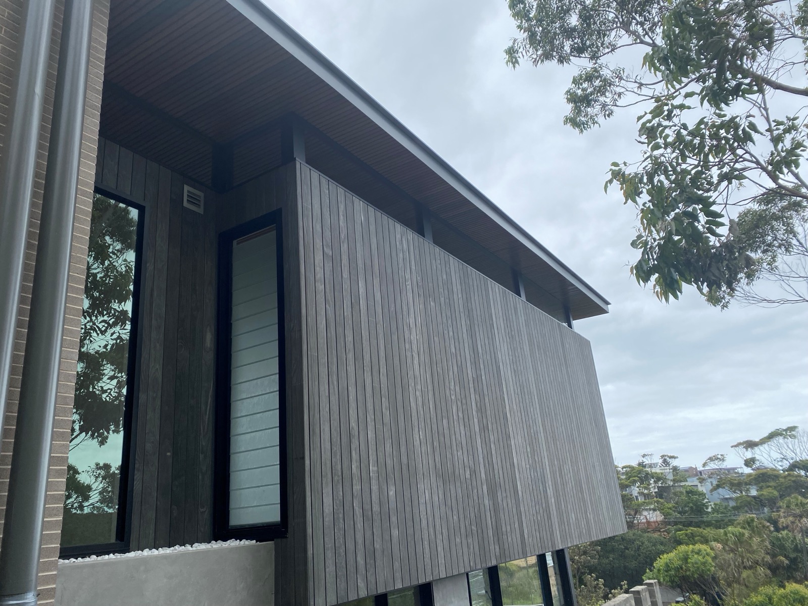 Back Priming Wood Siding: What Actually Controls Moisture from Behind