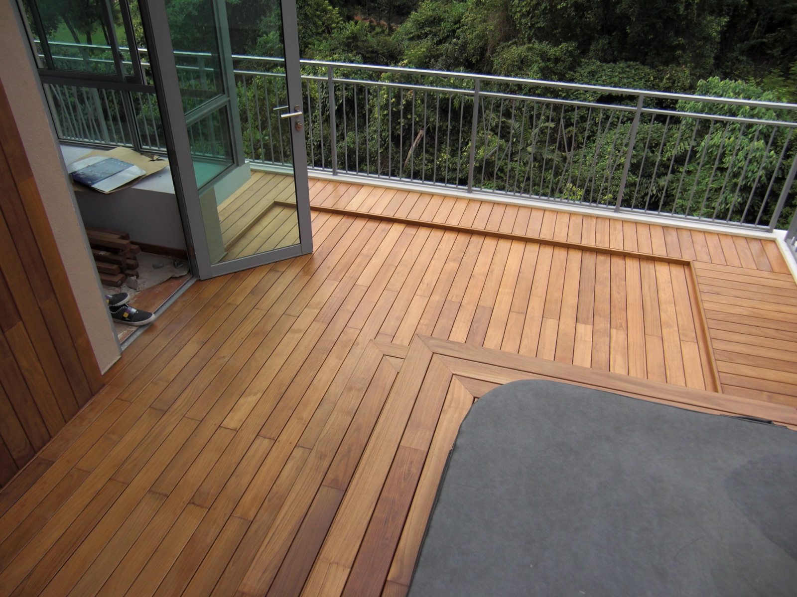 Tropical hardwood patio deck around a hot tub