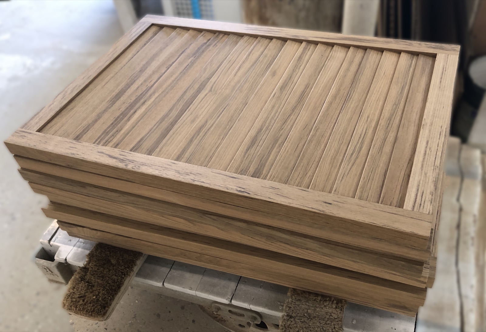 Teak louver panels with the blades set in their frames