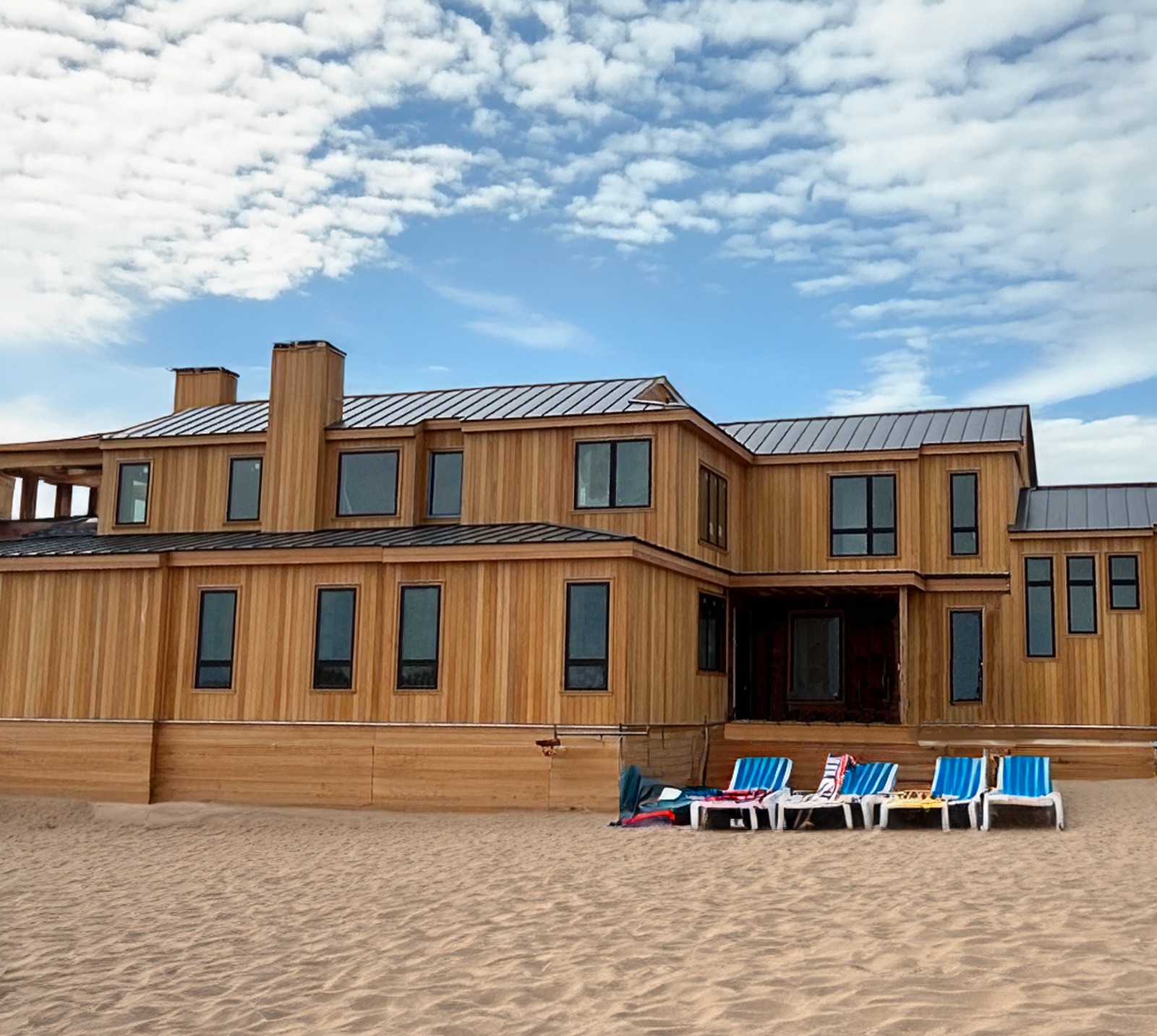 Coastal home clad and decked in tropical hardwood