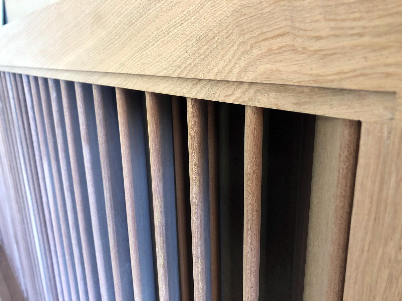 Fixed Teak louvers seen from the side at close range