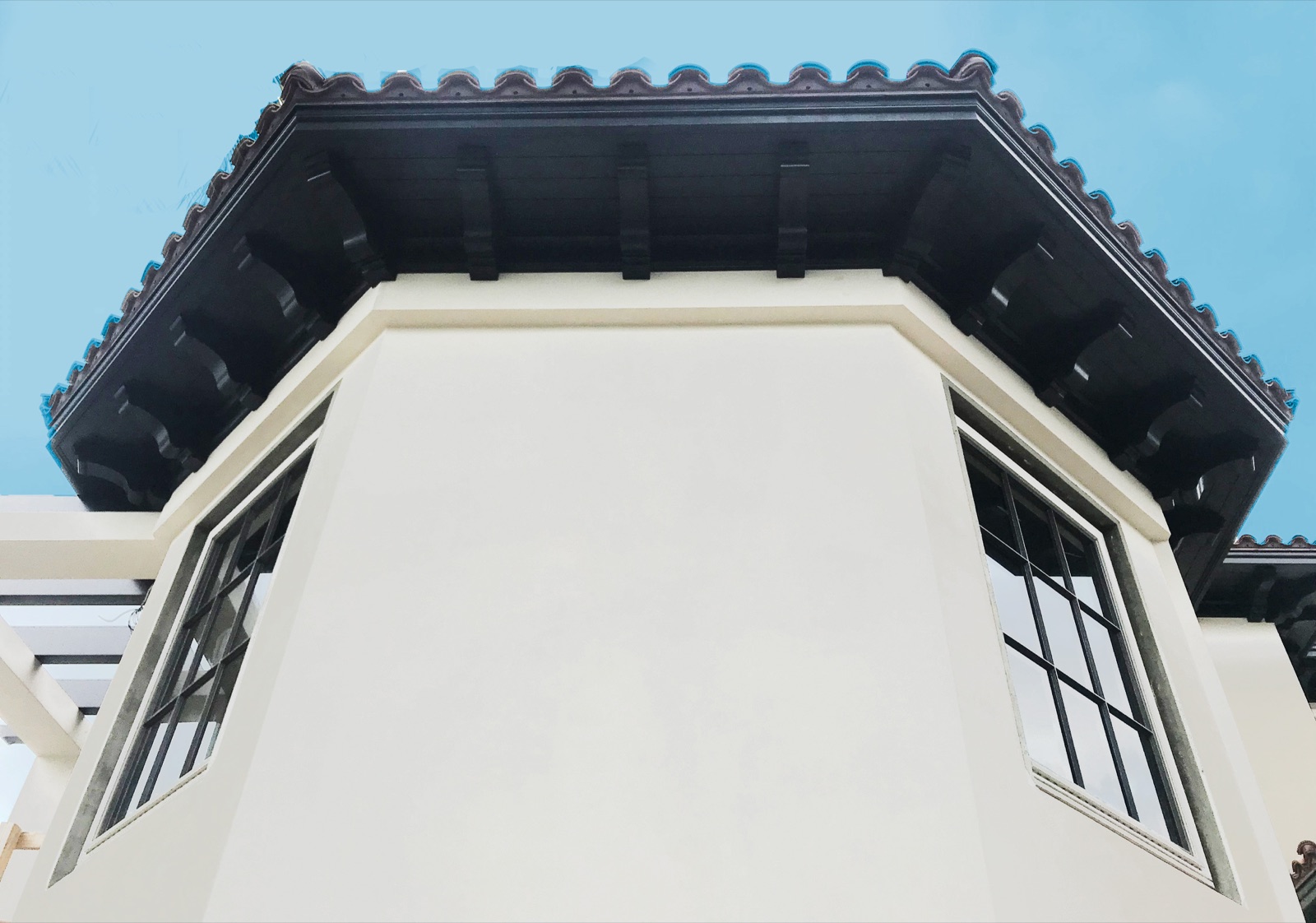 Shaped rafter tails installed on a roof edge
