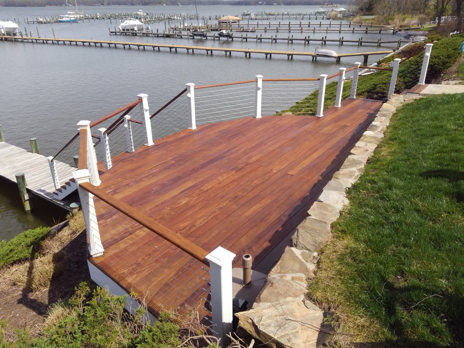 Tropical hardwood deck gapped and framed for drainage