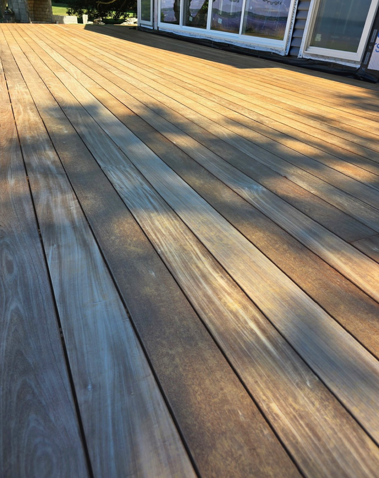 Weathered tropical hardwood deck surface