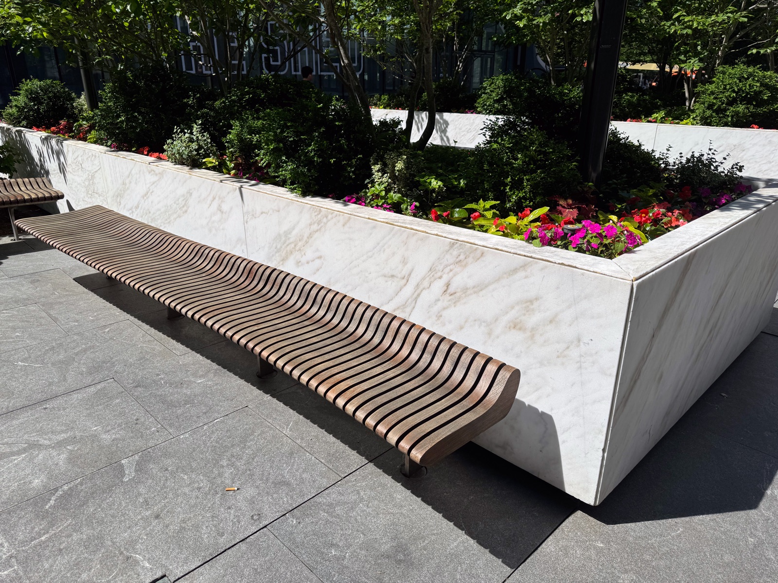 Tropical hardwood benches and planters in an urban park