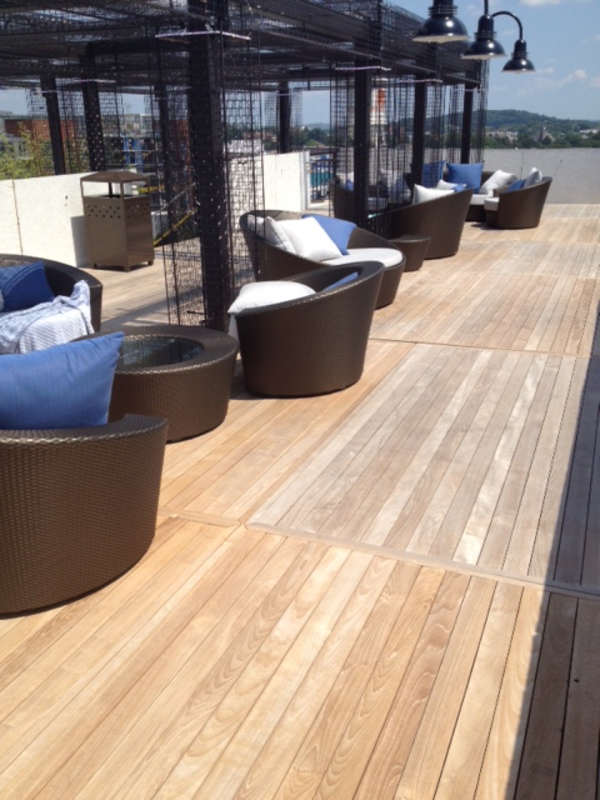 Which Tropical Hardwood Lasts Longest on a Commercial Rooftop Deck? A Material-Behavior Guide