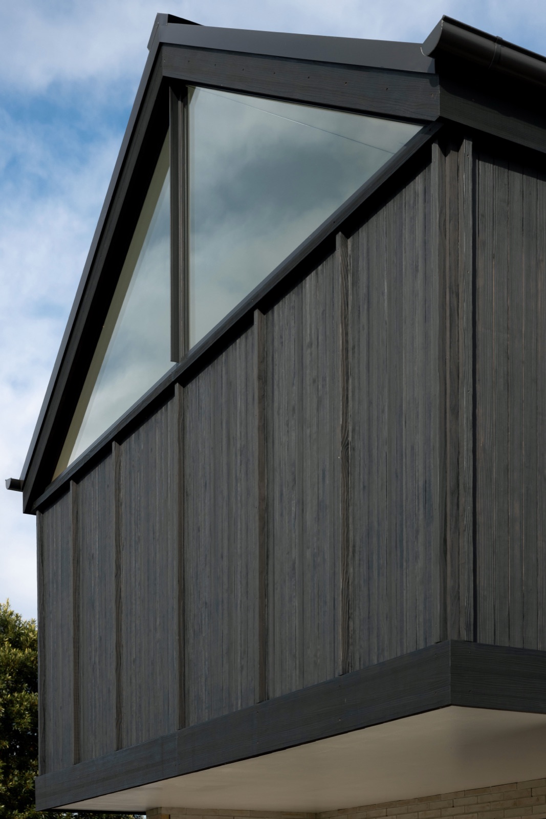Wide modified fascia board running the length of an eave