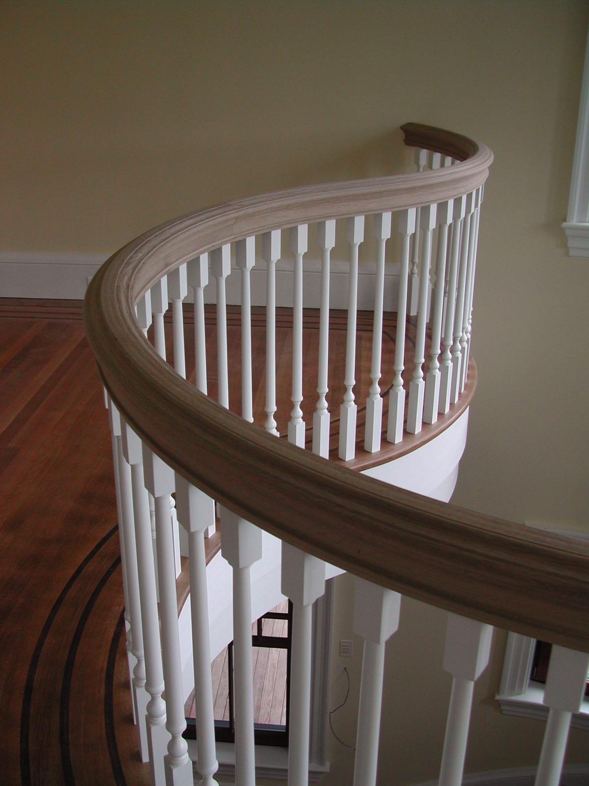 Handrail running around the upper landing