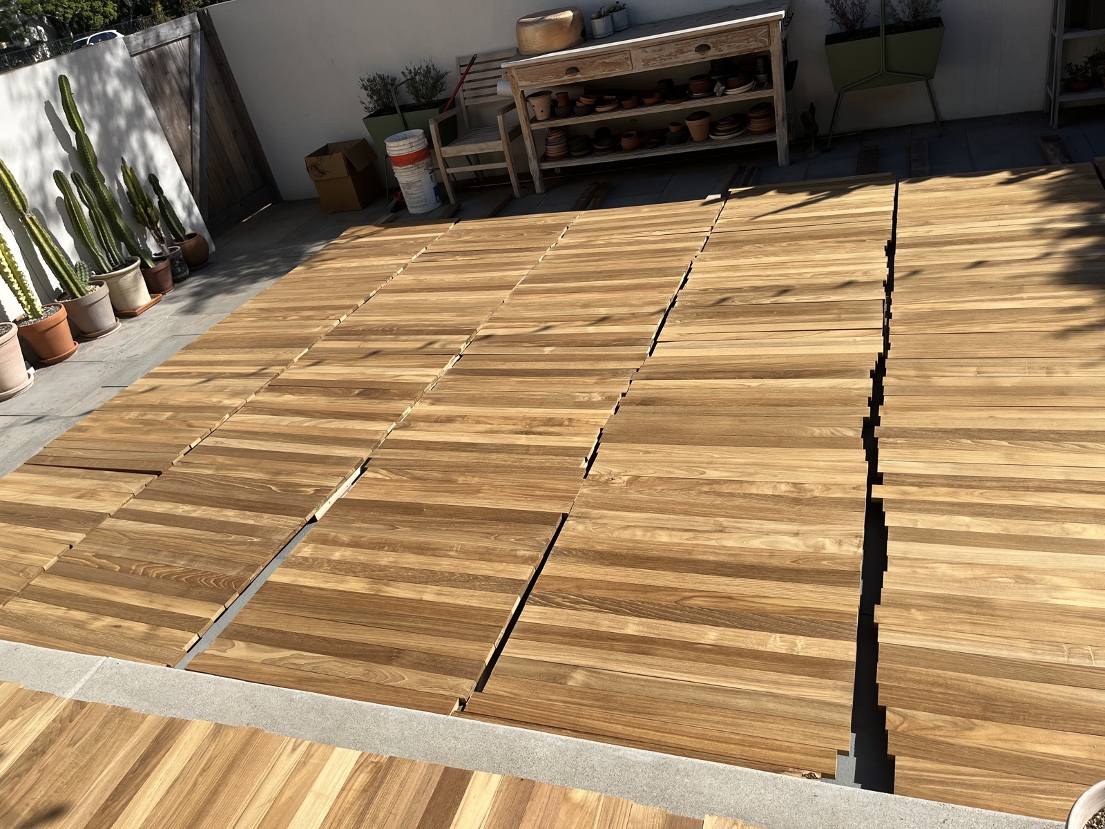 Plantation Teak boards weathering in open sun